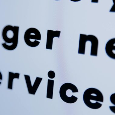 Close-up of black text on a white screen emphasizing 'services'.